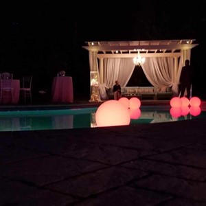 DesignLight backyard wedding lighting on pool